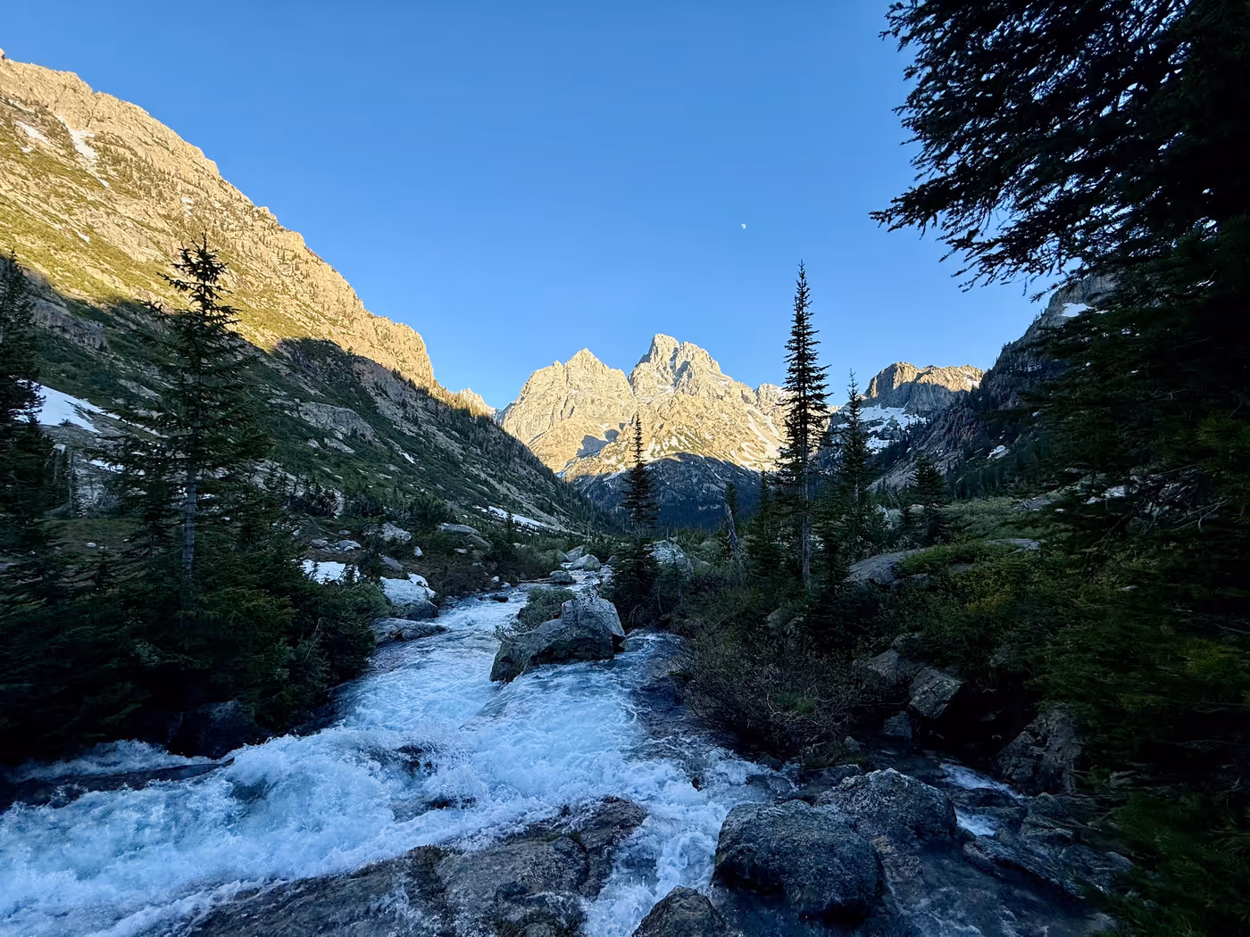 A backcountry campsite scene in long evening light.
