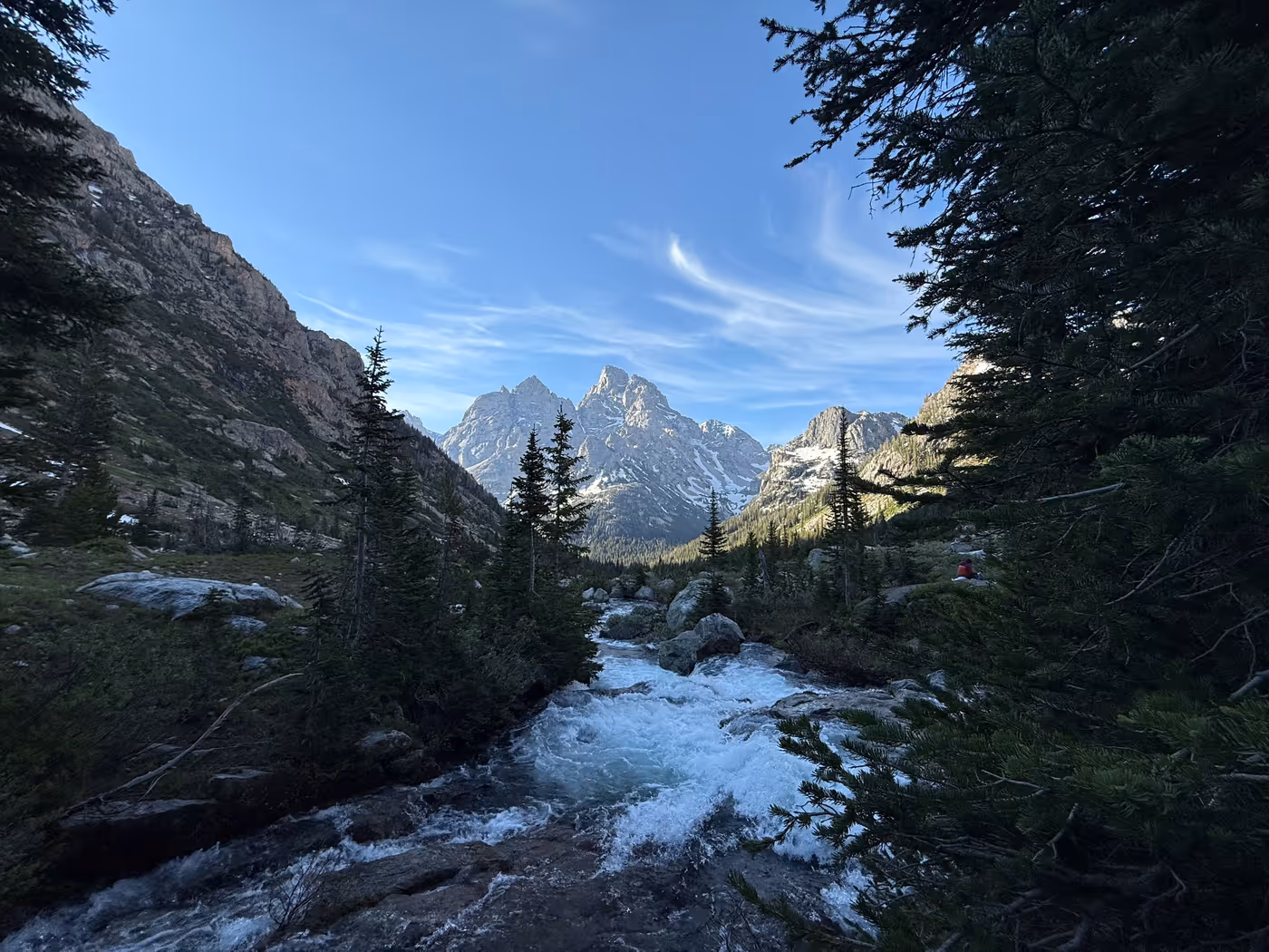 A wide view of the canyon and peaks at dawn.